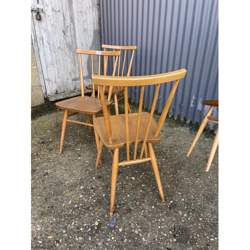 230 - A set of four light elm Ercol dining chairs