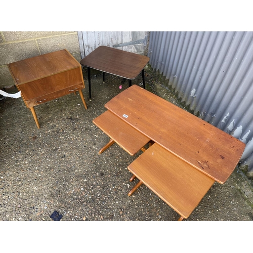 234 - A teak nest of three together with a retro table and a sewing box