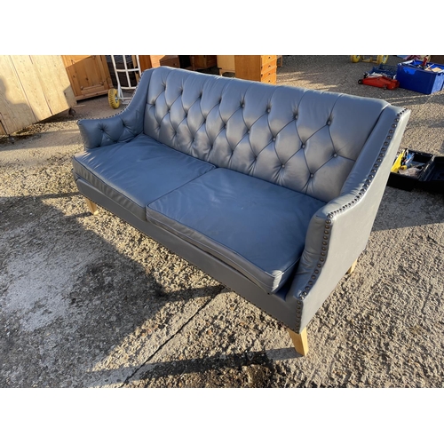 244 - A light blue leather chesterfield style buttoned sofa