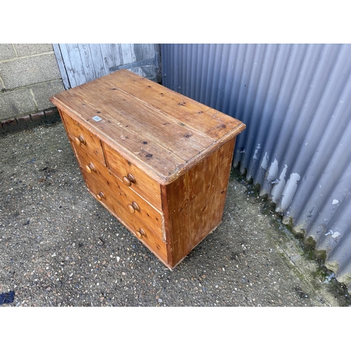 246 - A small antique pine chest of four drawers