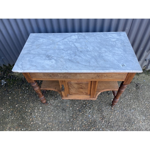 253 - An oak marble washstand with white marble top