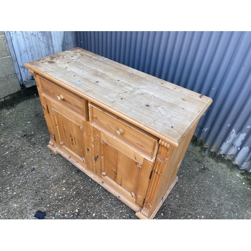 256 - A french pine two drawer and two door  sideboard