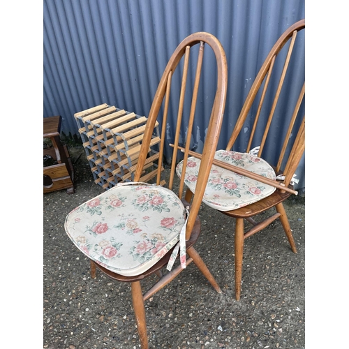 269 - Two ercol chairs for repair together with a wine rack and a magazine rack