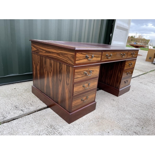 275 - A large reproduction mahogany twin pedestal desk with red leather top 5ft. X3ft