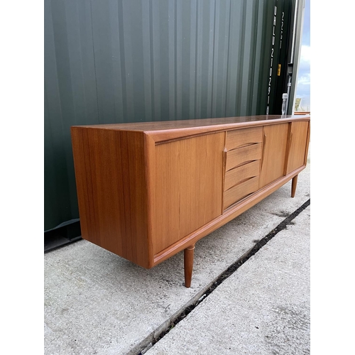 282 - A mid century danish teak sideboard with three sliding doors and three drawers marked MOBLER - MASE ... 