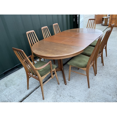 283 - An extending teak dining table with two extension leaves together with a set of 8 Danish teak dining... 