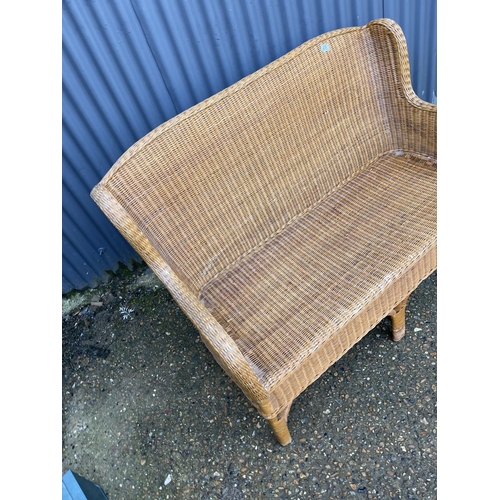 29 - A wicker two seater sofa