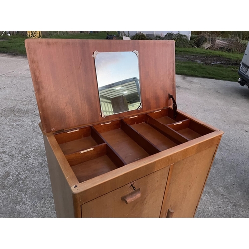 294 - A mid century light oak tallboy with lift up top