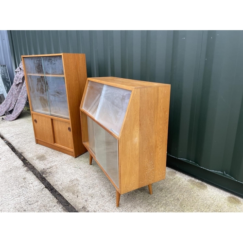 305 - Two mid century glazed cabinets with glass sliding doors