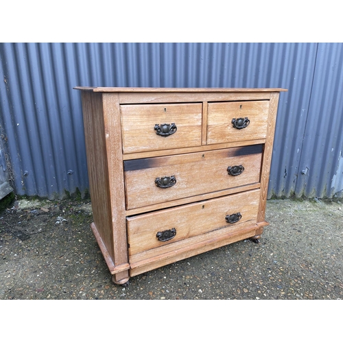 31 - An Edwardian satinwood chest of four drawers