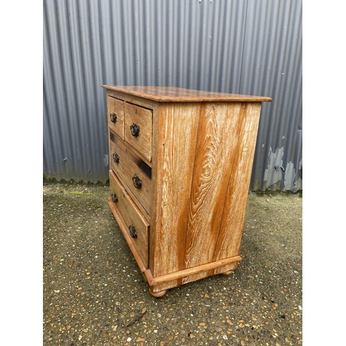 31 - An Edwardian satinwood chest of four drawers