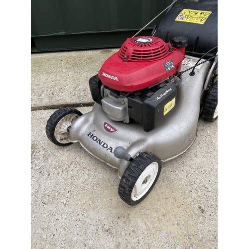 311 - A HONDA IZZY petrol lawn mower - recently serviced with handbook