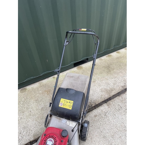 311 - A HONDA IZZY petrol lawn mower - recently serviced with handbook