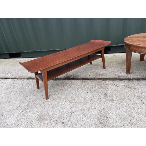 312 - A retro teak coffee table and a circular coffee table