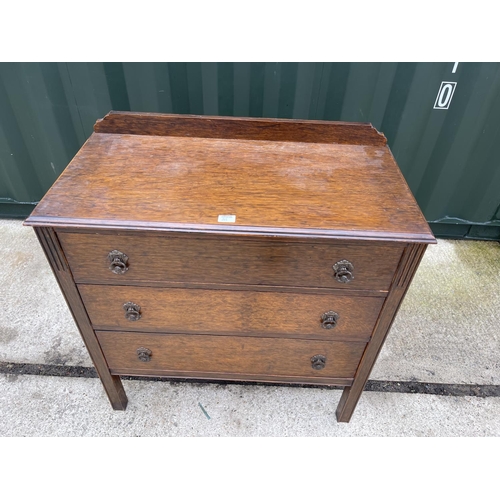 313 - An early 20 th century oak chest of three drawers