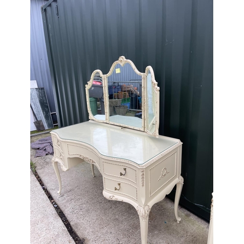 317 - A white painted and gold gilt french style bedroom pair consisting of a large 9 drawer chest of draw... 