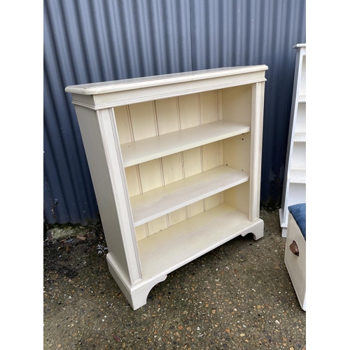 33 - A white painted open fronted bookcase by Laura Ashley together with another painted bookcase and a p... 
