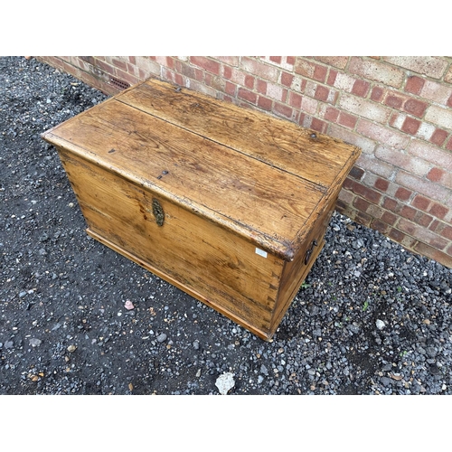 335 - A very large antique pine blanket box trunk with fitted candle box to the interior