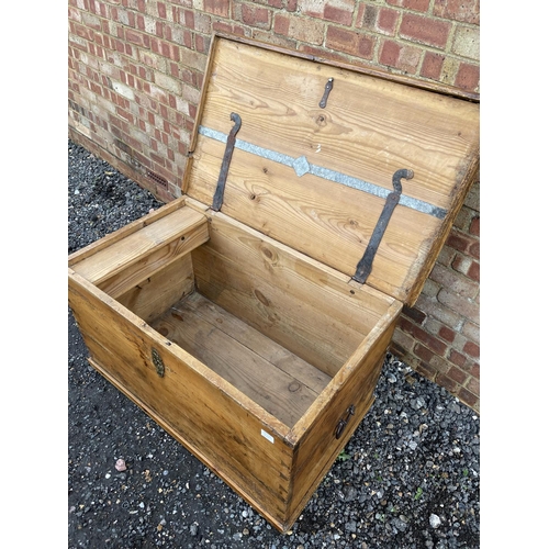 335 - A very large antique pine blanket box trunk with fitted candle box to the interior