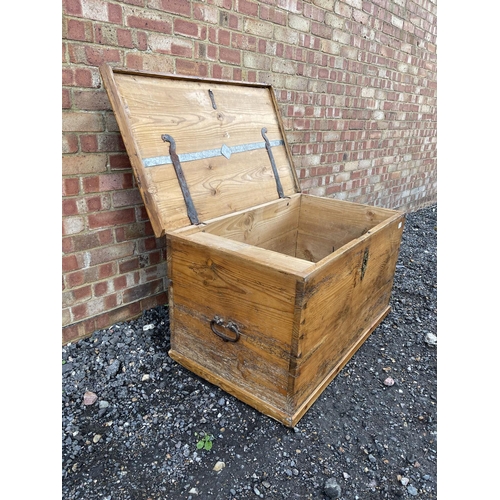 335 - A very large antique pine blanket box trunk with fitted candle box to the interior