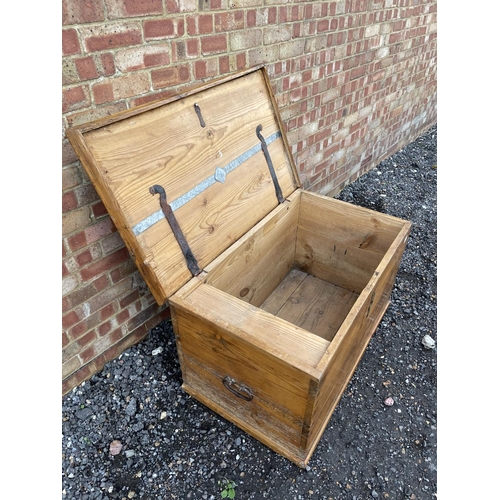 335 - A very large antique pine blanket box trunk with fitted candle box to the interior