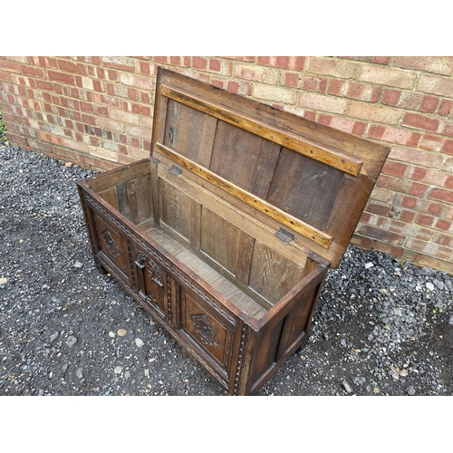 344 - An antique oak three panel carved  blanket box coffer