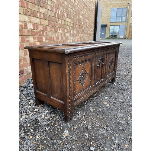 344 - An antique oak three panel carved  blanket box coffer