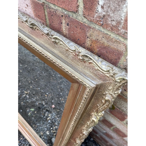 349 - An antique gold gilt framed overmantel mirror