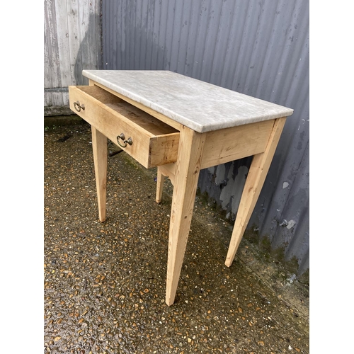 354 - A country pine single drawer table with a marble top