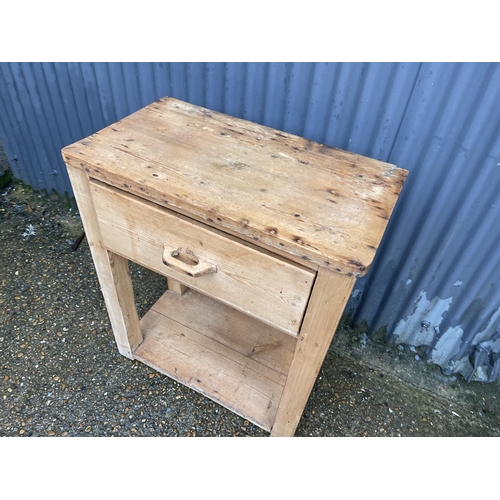 357 - An antique pine butcher block table with one drawer