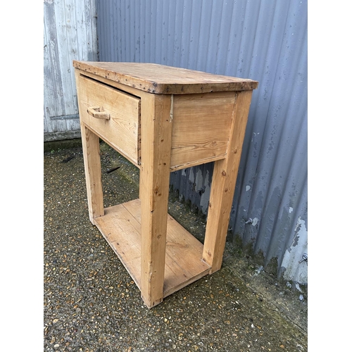 357 - An antique pine butcher block table with one drawer