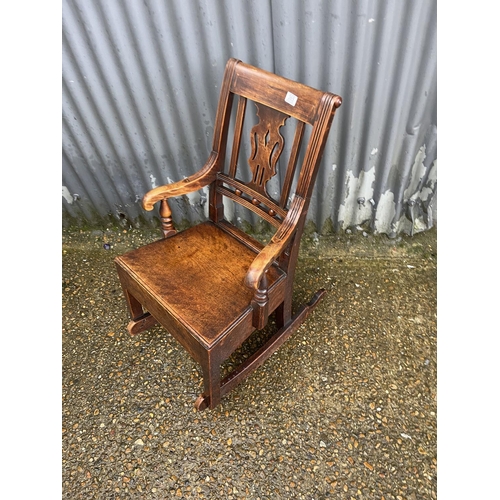 365 - An Edwardian mahogany rocking chair