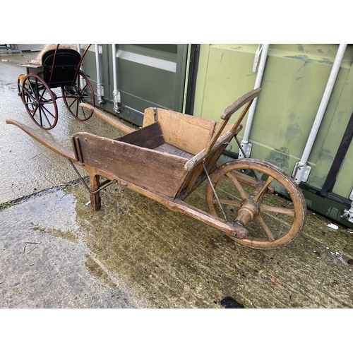 376 - A vintage wooden push barrow cart with removable sides