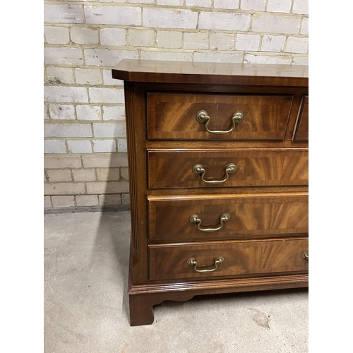 381 - A large reproduction mahogany lowboy chest of nine drawers