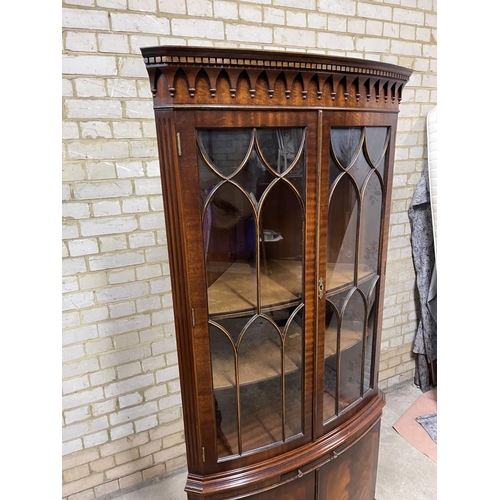 383 - A large reproduction mahogany double door corner cabinet