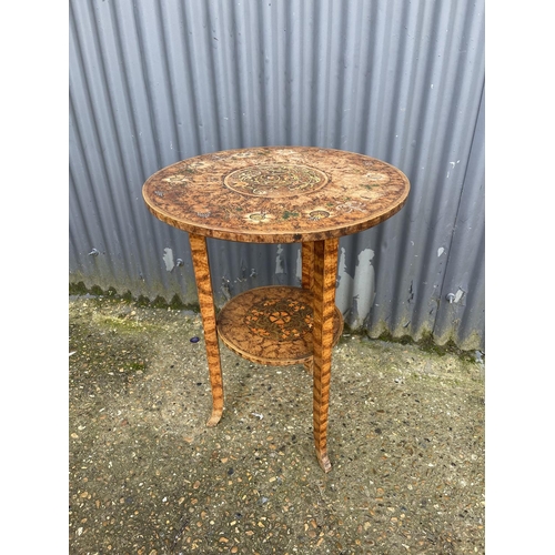 39 - An unusual hand painted circular occasional table
