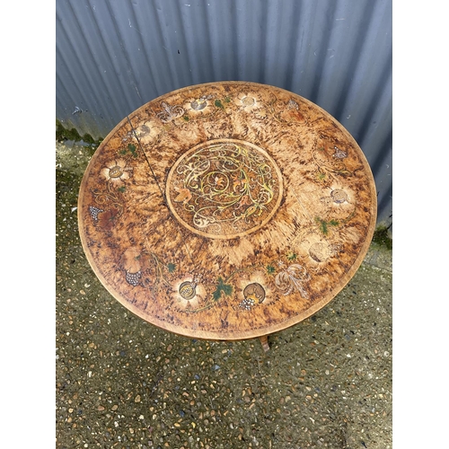 39 - An unusual hand painted circular occasional table