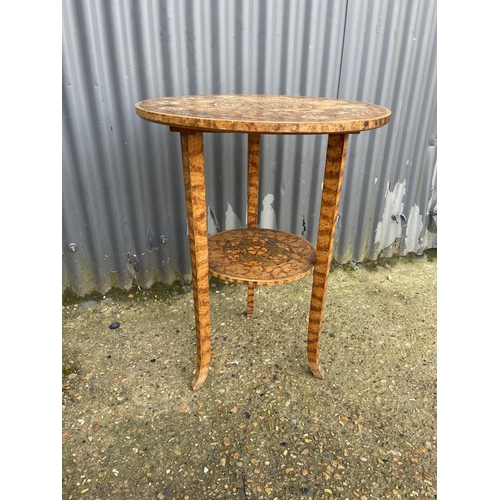 39 - An unusual hand painted circular occasional table