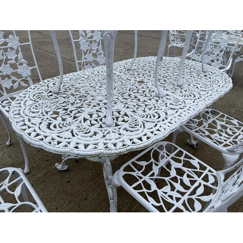 390a - A large white painted aluminium garden table together with 8 matching chairs