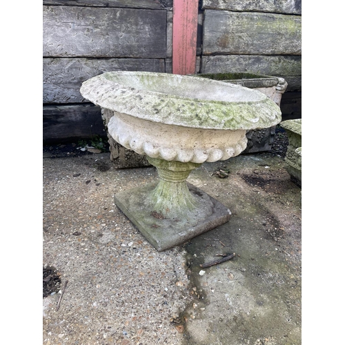 393 - A circular pedestal garden urn 62 diameter 50high