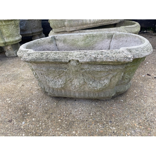 394 - A set of three oblong concrete planters 80x40x30