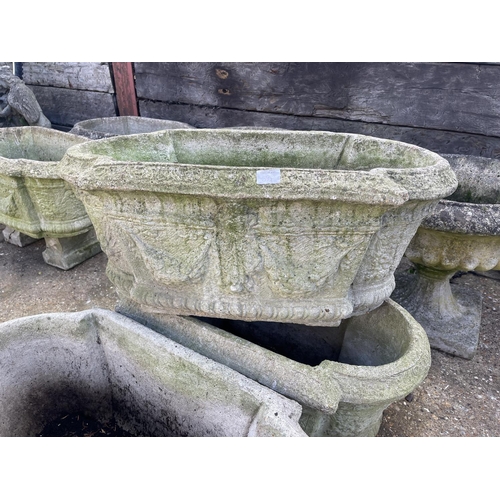 394 - A set of three oblong concrete planters 80x40x30