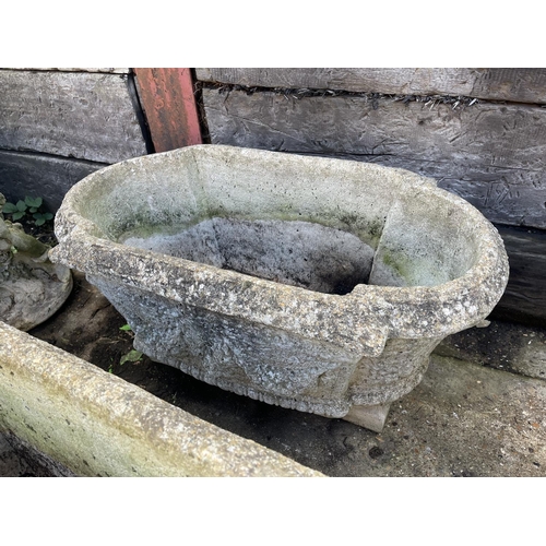 396 - A set of three oblong concrete planters 80x40x30 raised on feet