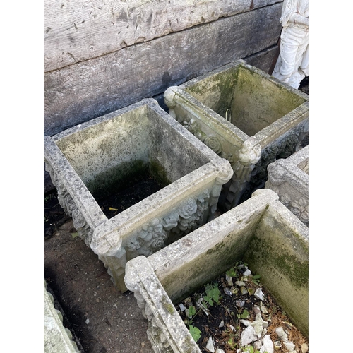 400 - A set of four square form concrete garden planters with decorative rose pattern 48cm square.  44cm h... 