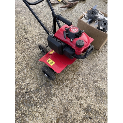 400a - A Honda petrol powered rotavator / scarifier with box of attachments