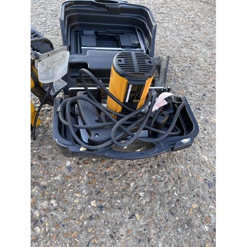 447 - A jcb bench grinder together with a cased jcb skill saw