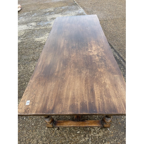 46 - A large refectory style oak dining table 230x90
