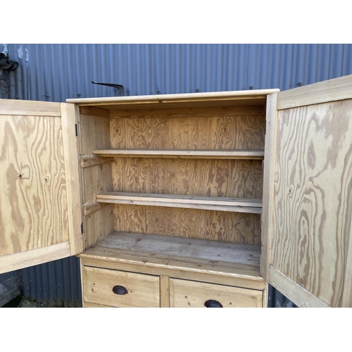 50k - A country pine linen press / larder cupboard with two door top over four drawers  (with key)