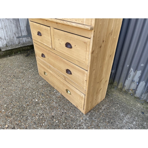 50k - A country pine linen press / larder cupboard with two door top over four drawers  (with key)