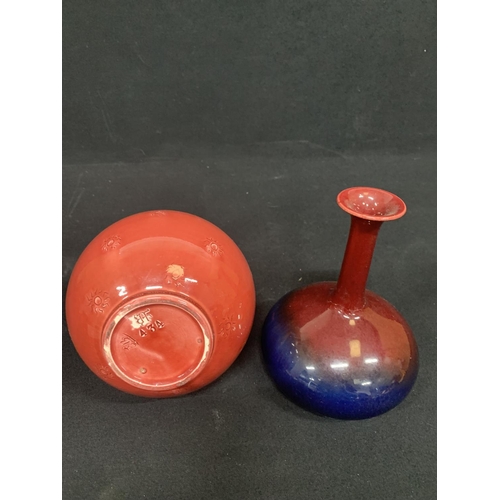 547 - Red long stemmed vase, height 27cms, marked to the base and red and blue vase, repaired